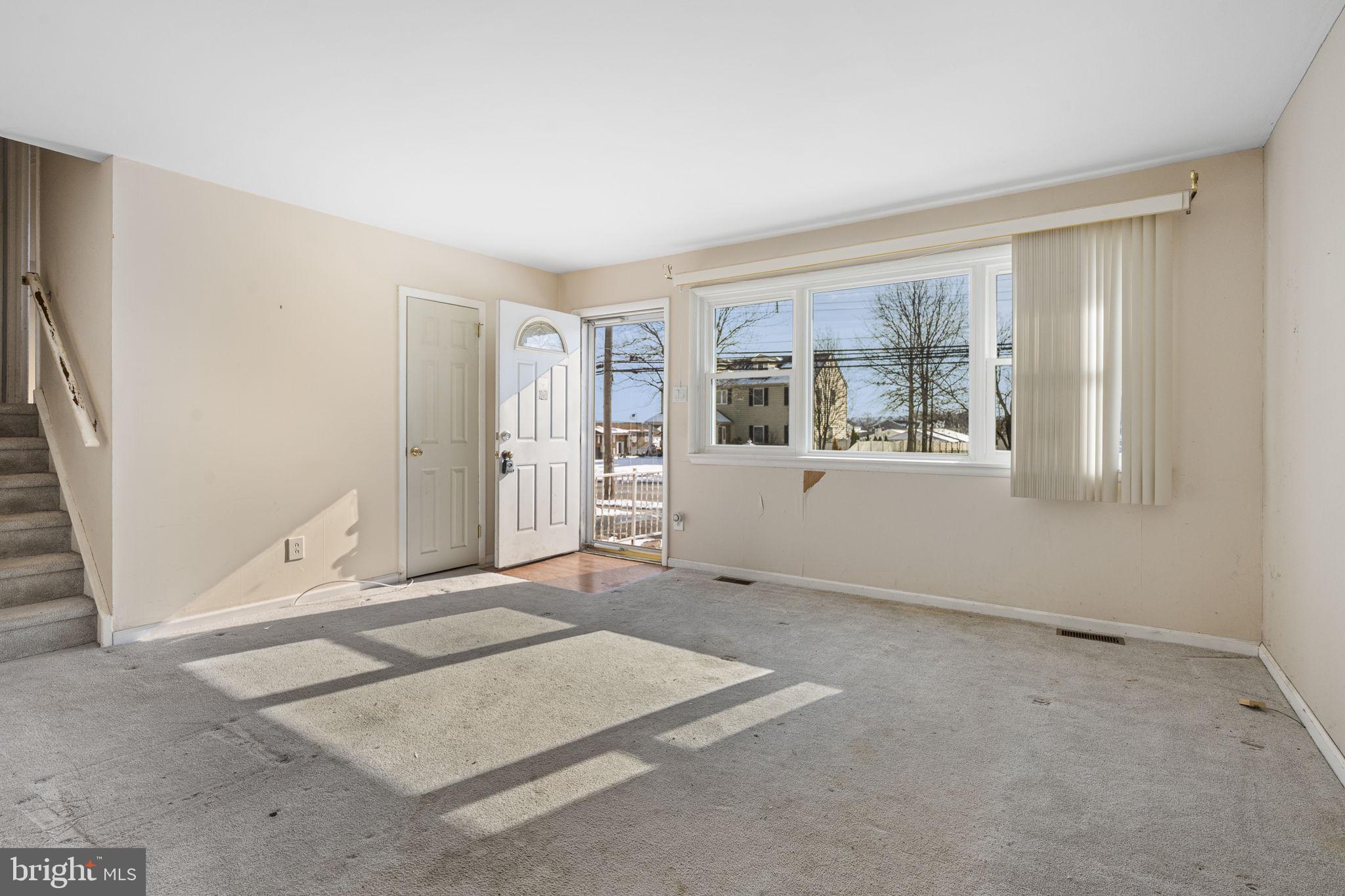 146 Ross Road King of Prussia, PA 19406 - Photo 4 of 27 an empty room with windows and entrance