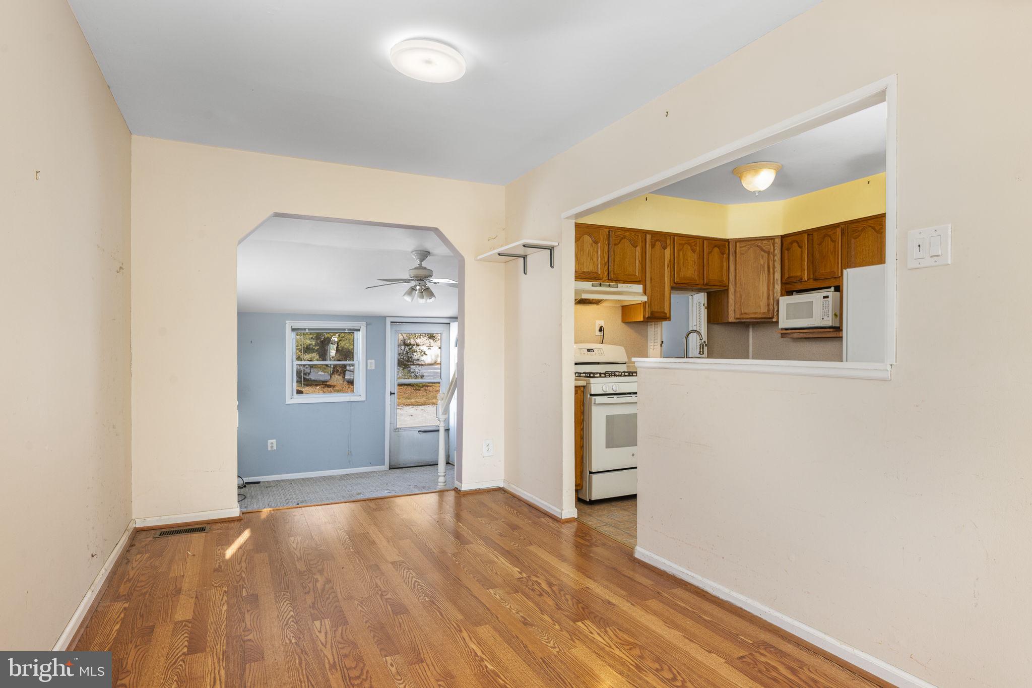 146 Ross Road King of Prussia, PA 19406 - Photo 6 of 27 a view of a kitchen with wooden floor and a refrigerator