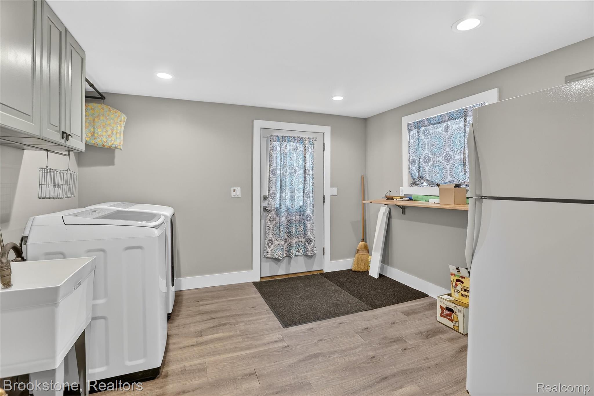 2450 North Lakeshore Road Carsonville, MI 48419 - Photo 17 of 27 Laundry room with light wood finished floors, recessed lighting, and independent washer and dryer