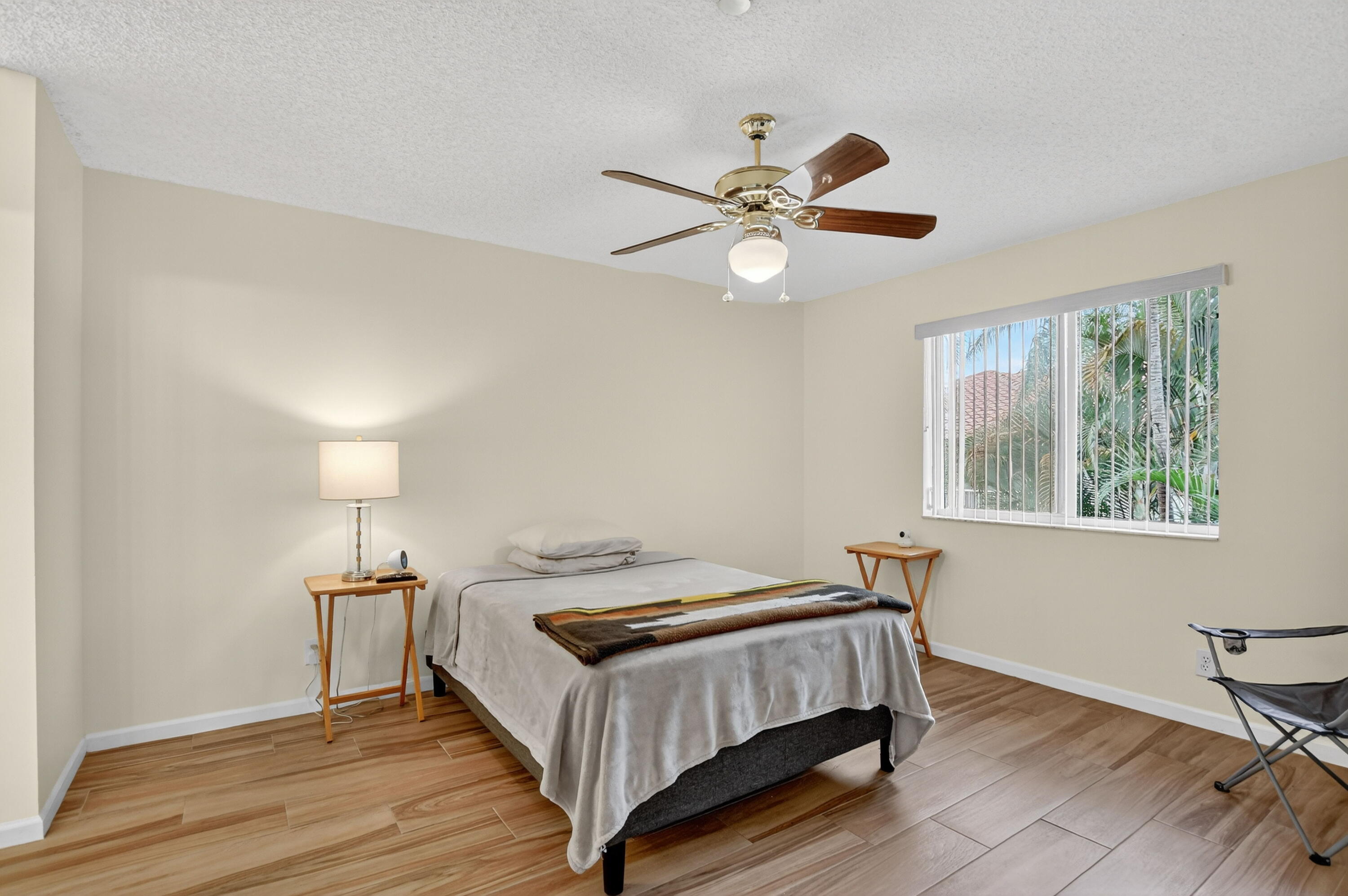 380 Northwest 67th Street, Unit 207 Boca Raton, FL 33487 - Photo 12 of 34 a bedroom with a bed and a window