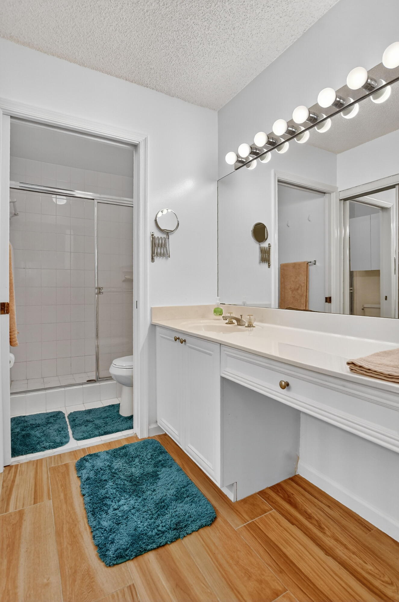 380 Northwest 67th Street, Unit 207 Boca Raton, FL 33487 - Photo 15 of 34 a bathroom with a sink and a mirror