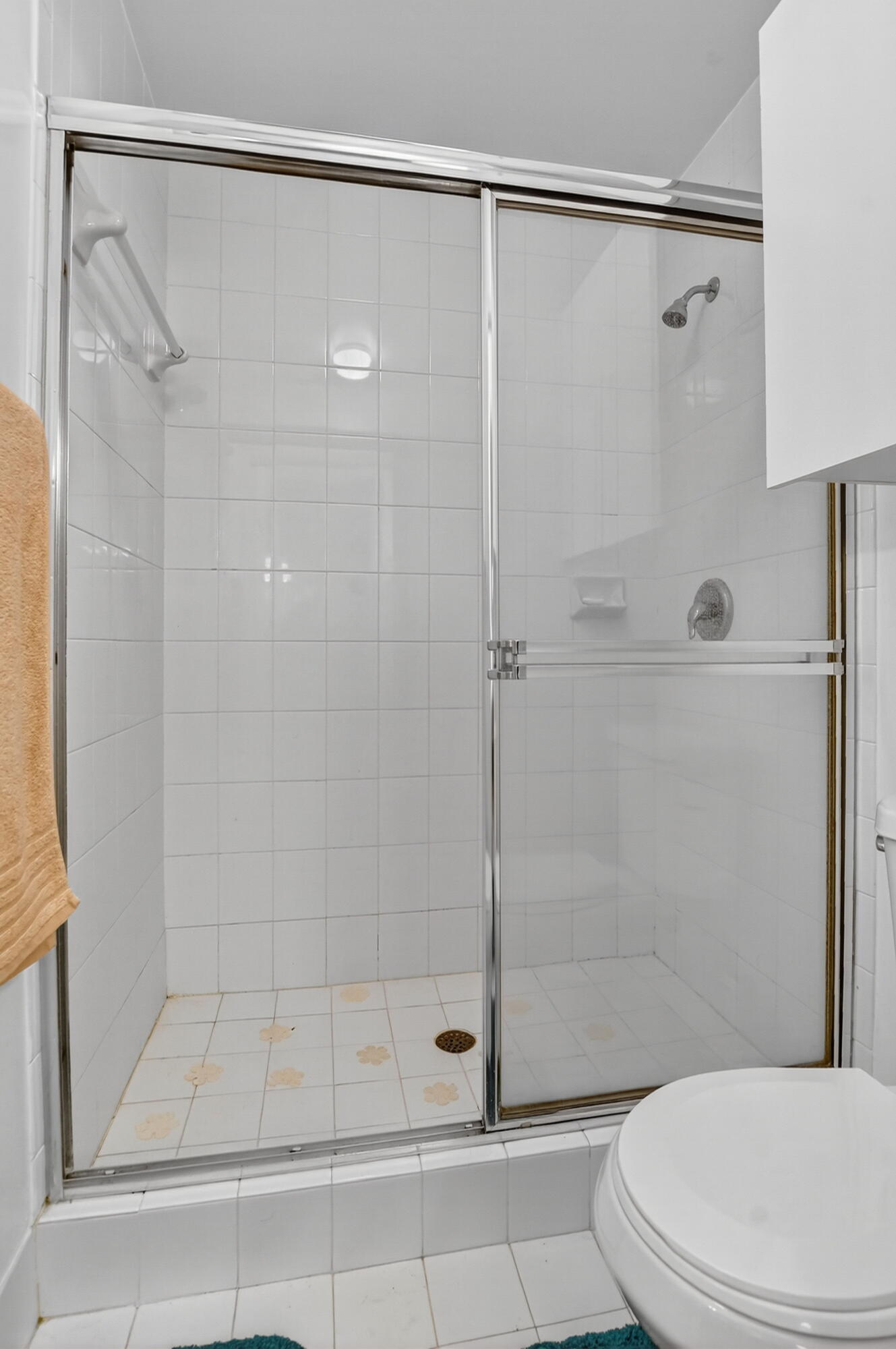 380 Northwest 67th Street, Unit 207 Boca Raton, FL 33487 - Photo 16 of 34 a bathroom with a shower and a toilet