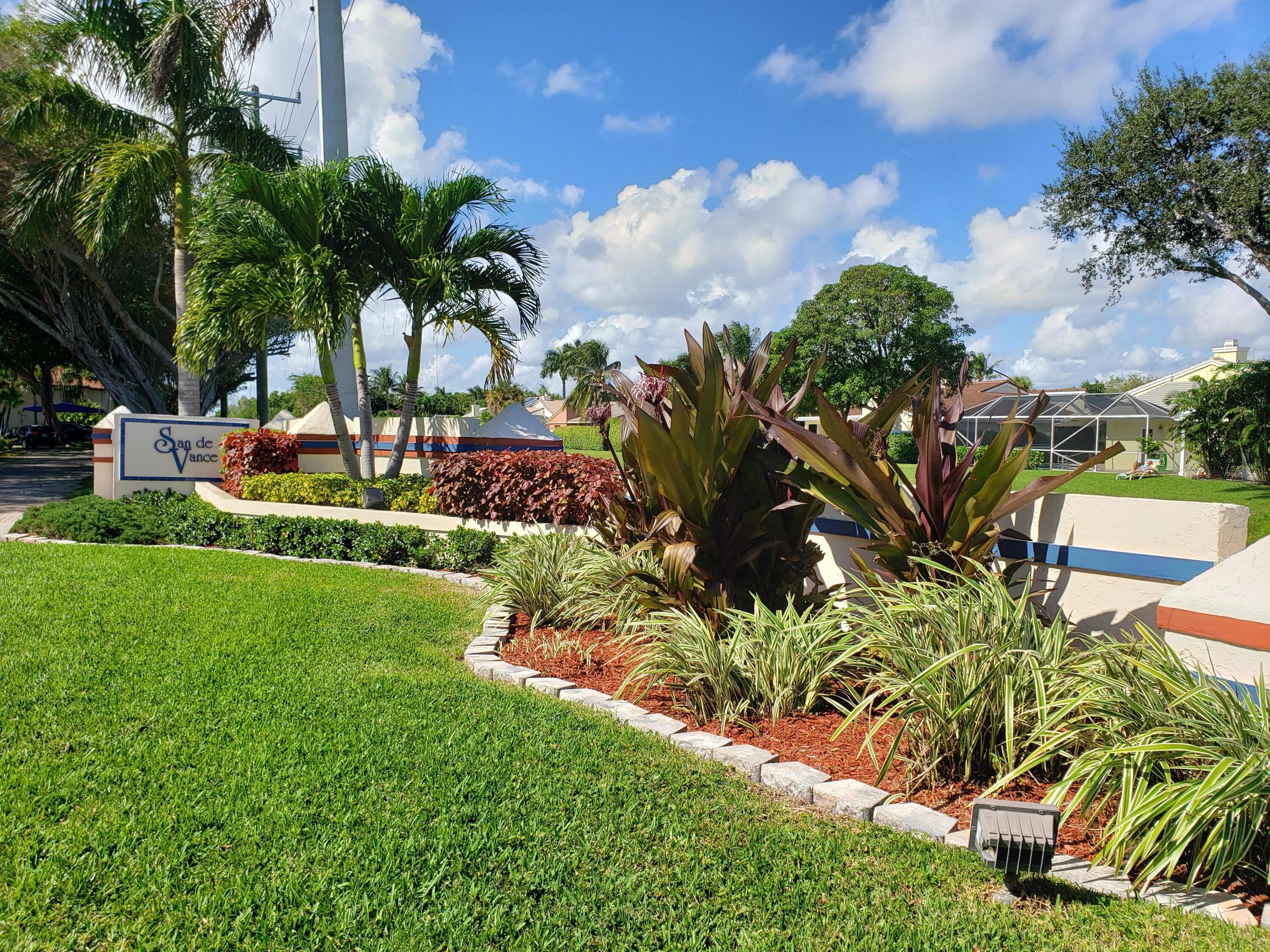 380 Northwest 67th Street, Unit 207 Boca Raton, FL 33487 - Photo 18 of 34 a view of a yard with a fountain