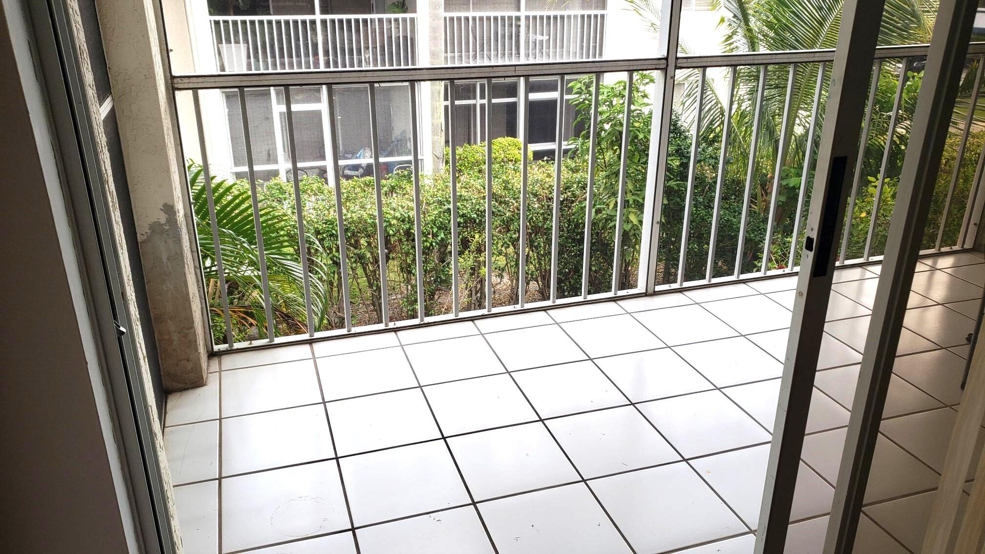 380 Northwest 67th Street, Unit 207 Boca Raton, FL 33487 - Photo 9 of 34 a view of a balcony