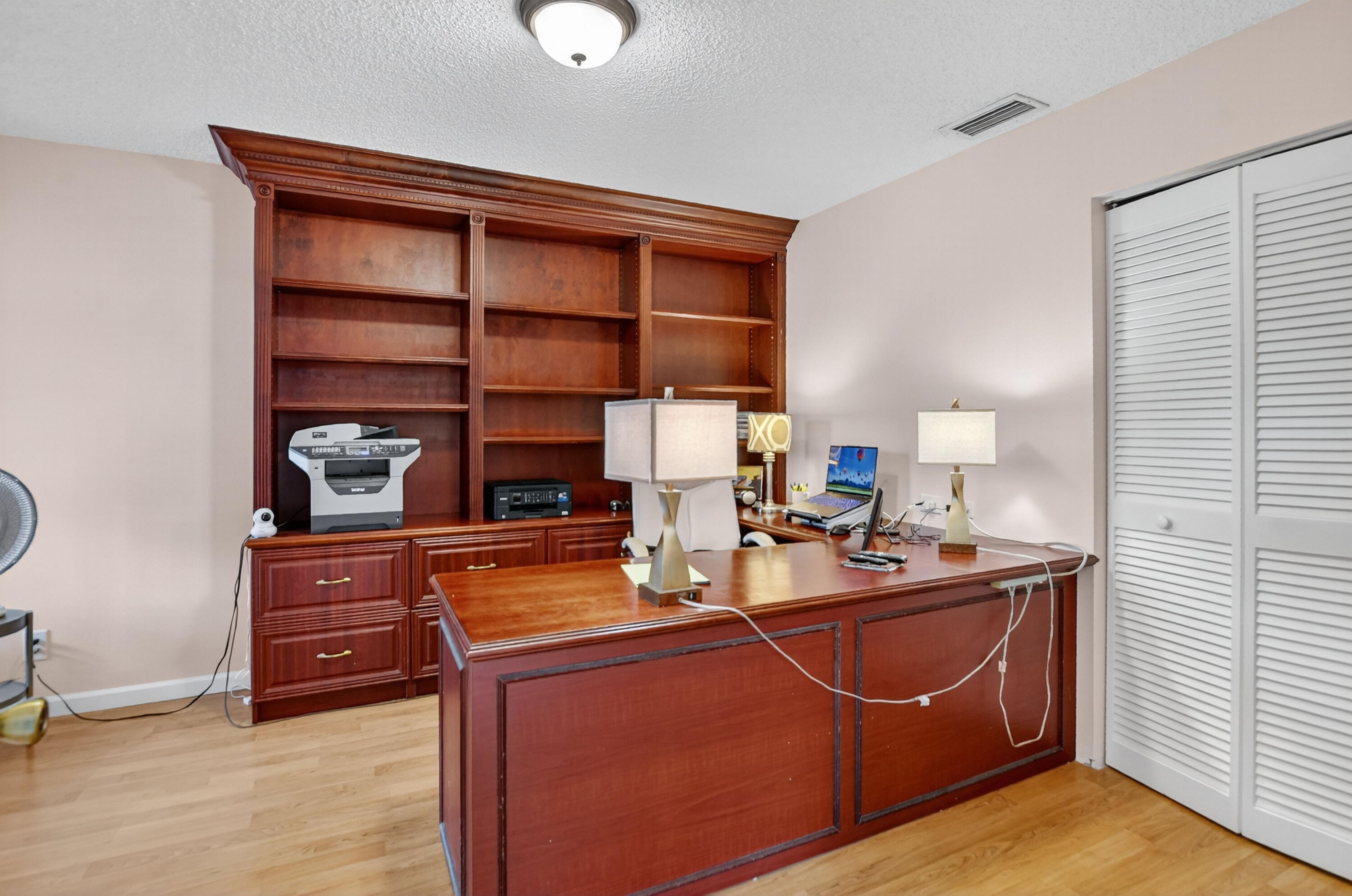 380 Northwest 67th Street, Unit 207 Boca Raton, FL 33487 - Photo 10 of 34 a room with a desk and chair