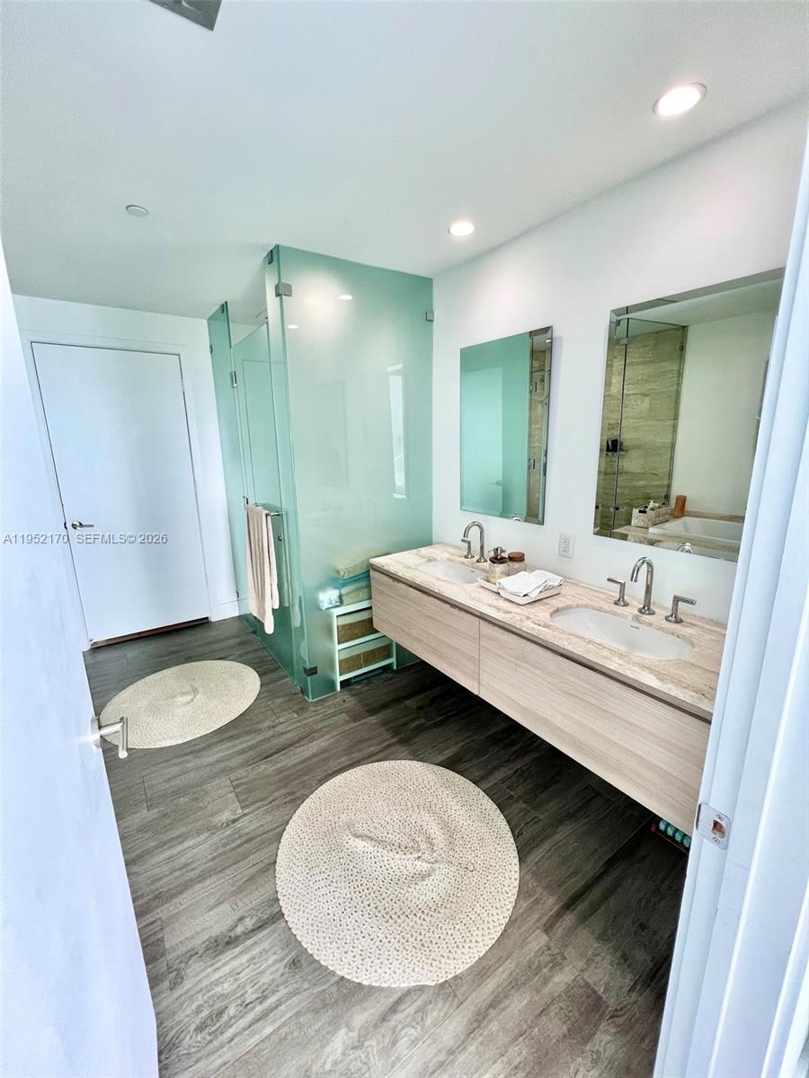 2900 Northeast 7th Avenue, Unit 2708 Miami, FL 33137 - Photo 14 of 25 a bathroom with a double vanity sink and a mirror
