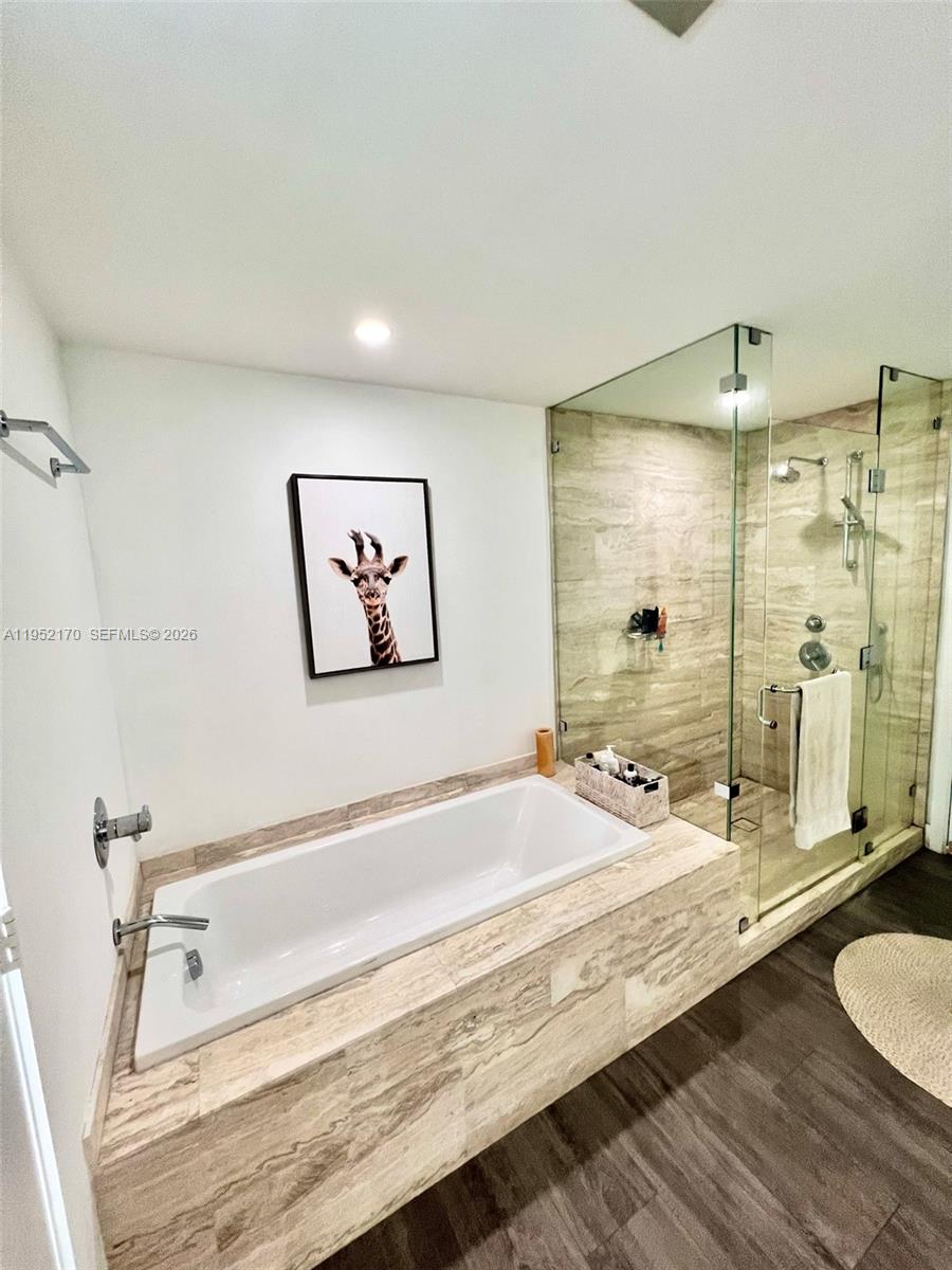 2900 Northeast 7th Avenue, Unit 2708 Miami, FL 33137 - Photo 15 of 25 a spacious bathroom with a tub and shower