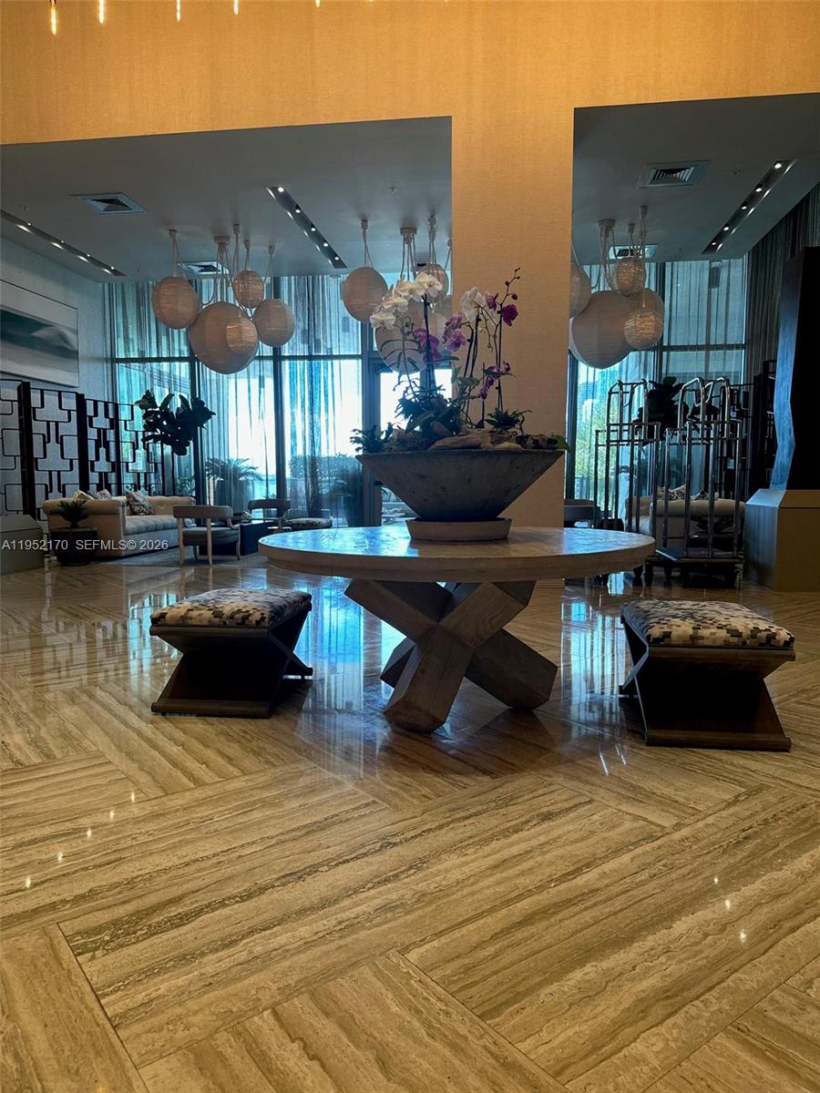 2900 Northeast 7th Avenue, Unit 2708 Miami, FL 33137 - Photo 4 of 25 a living room with lots of furniture and a wooden floor