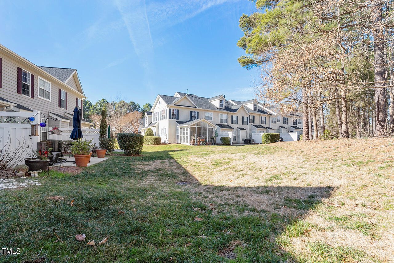 10145 Mizner Lane Raleigh, NC 27617 - Photo 38 of 61 Backyard buffer leads to golf course views of 12th fairway
