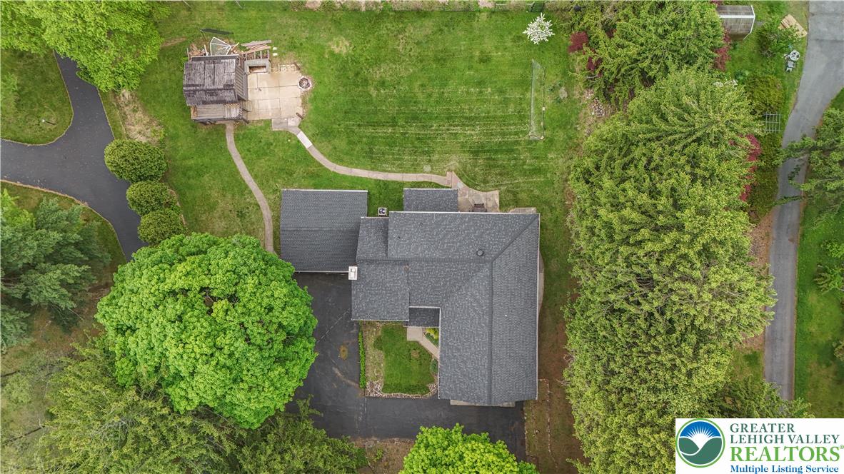 2242 Church Road Bethlehem, PA 18015 - Photo 71 of 74 an aerial view of a house with a garden and trees