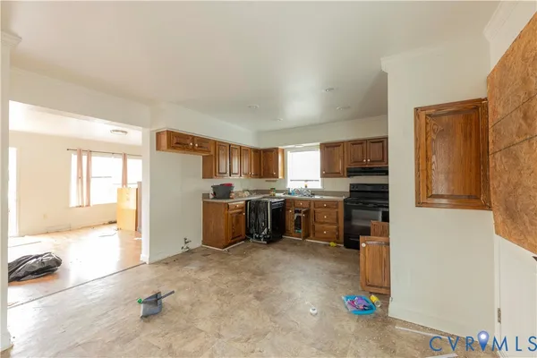 a kitchen with refrigerator and cabinets