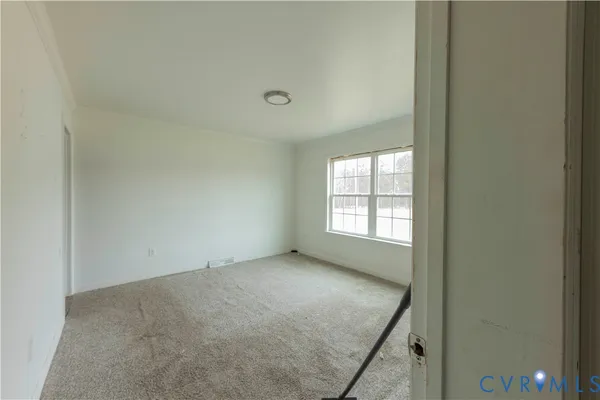 a view of an empty room and window