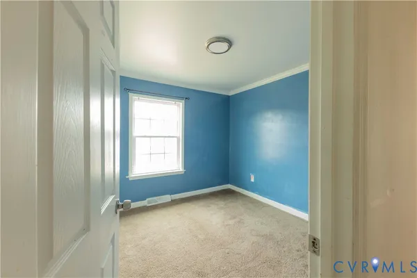 an empty room with a empty space and windows