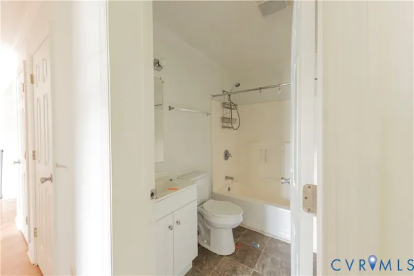 a bathroom with a toilet sink and shower
