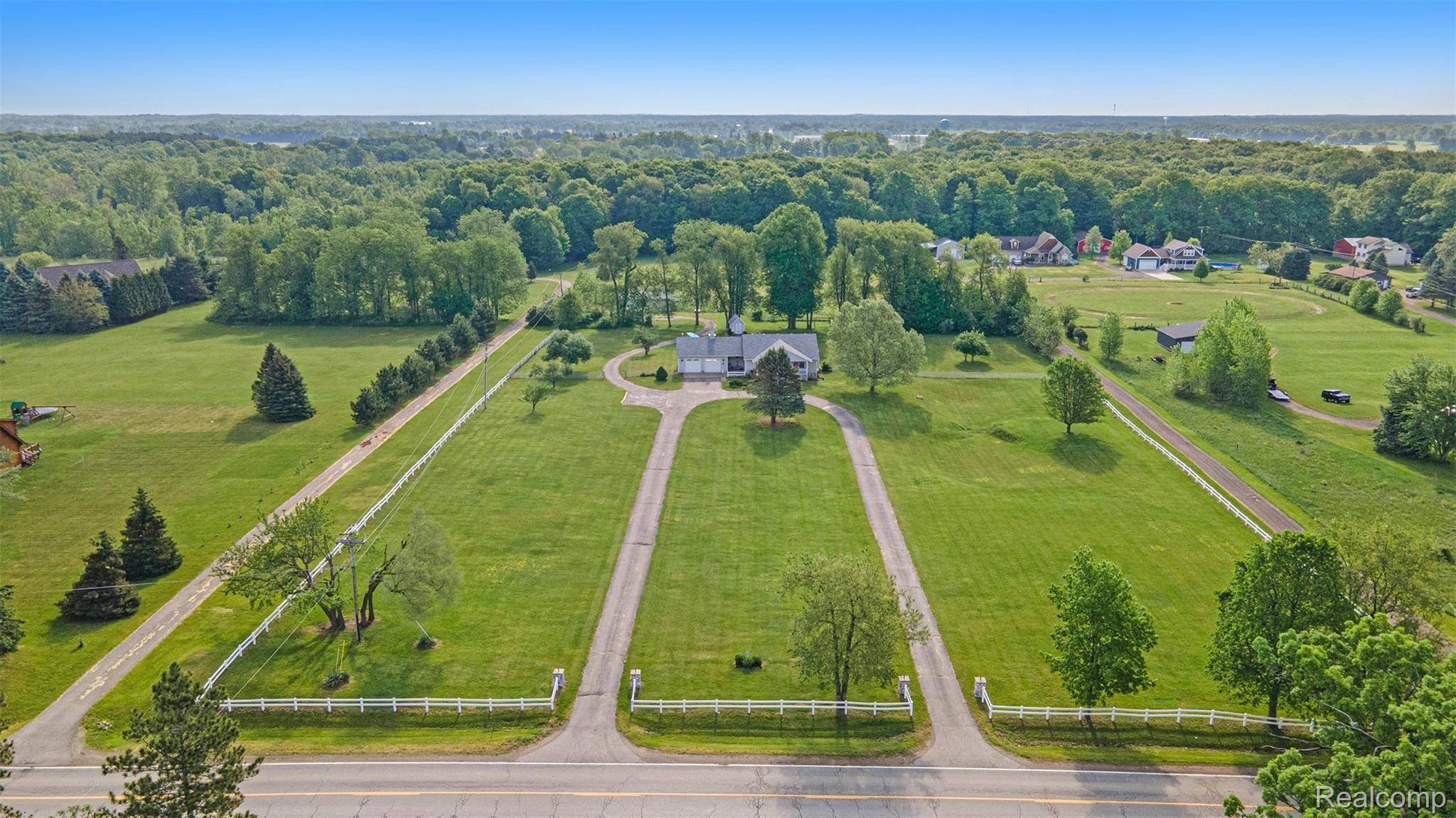 4250 North Nicholson Road Fowlerville, MI 48836 - Photo 8 of 48 Large fenced front yard, paved circle drive, and open back pasture are just a few of the benefits