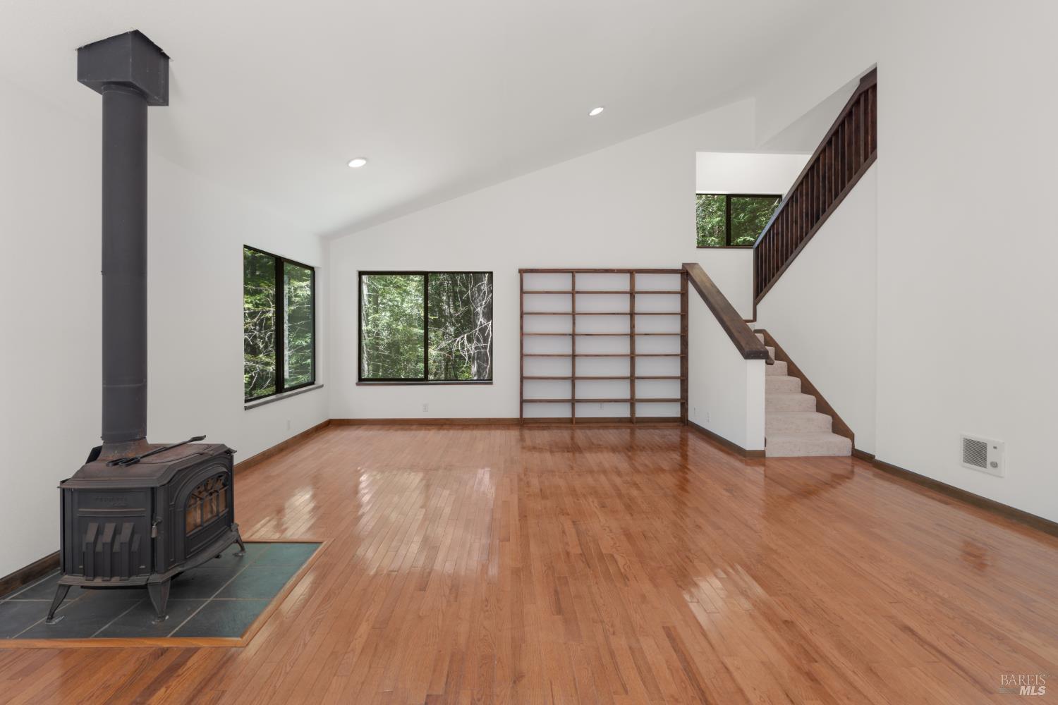 355 Chinquapin Lane The Sea Ranch, CA 95497 - Photo 6 of 31 a view of an empty room with wooden floor and a window