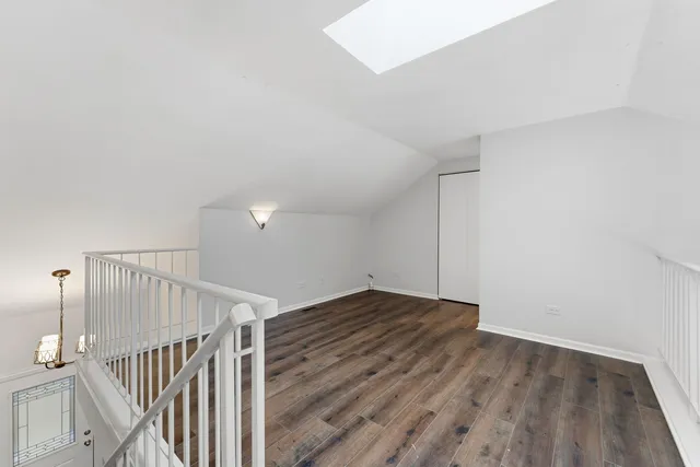 a view of an empty room with stairs