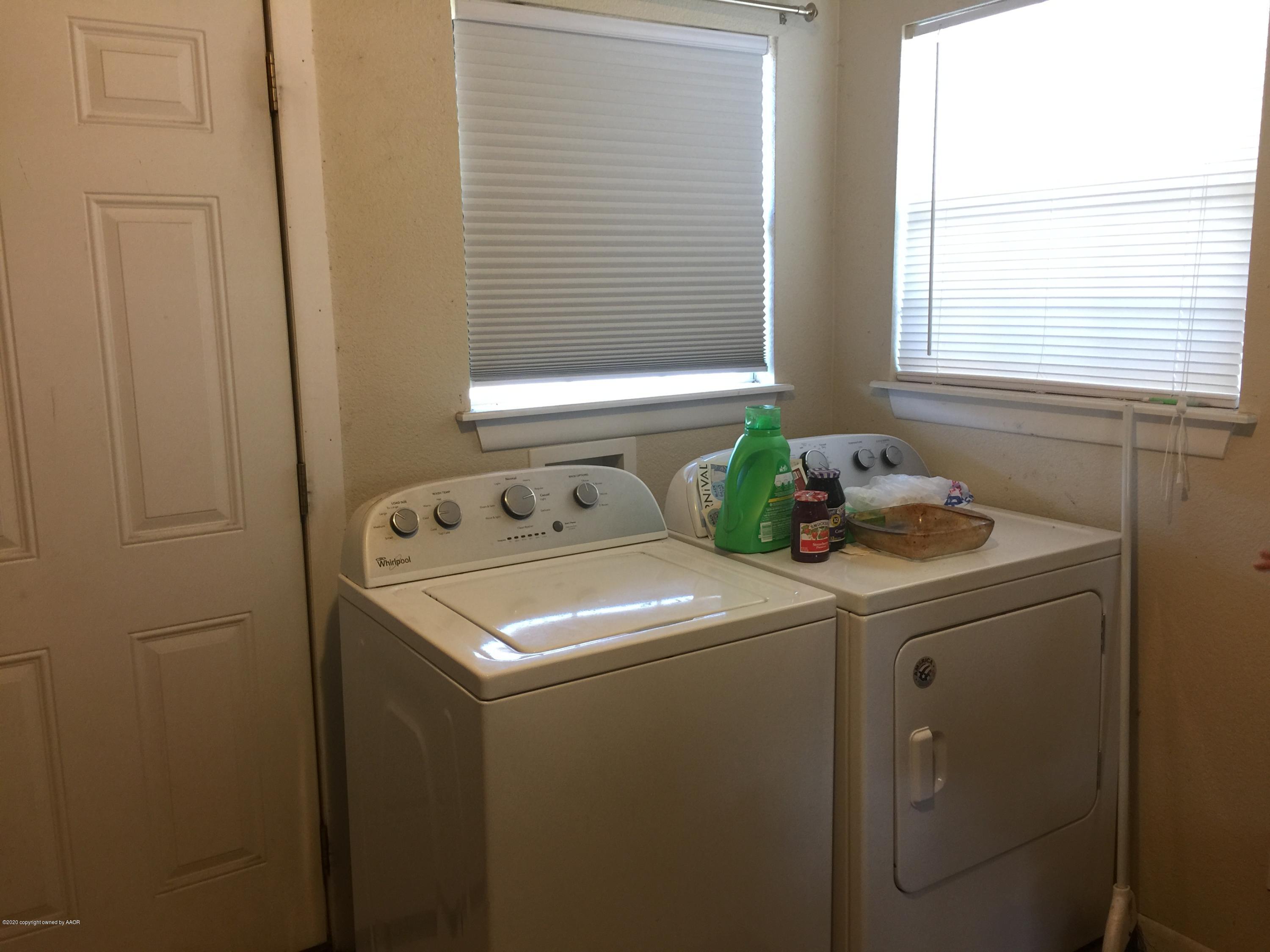 4602 South Hughes Street Amarillo, TX 79110 - Photo 4 of 7 a utility room with dryer and washer