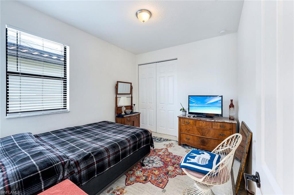 5459 Useppa Drive Ave Maria, FL 34142 - Photo 12 of 21 a bedroom with furniture and a window