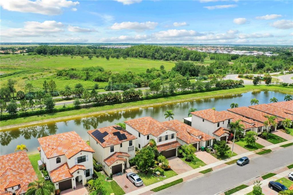 5459 Useppa Drive Ave Maria, FL 34142 - Photo 18 of 21 an aerial view of a house with outdoor space lake view and lake view