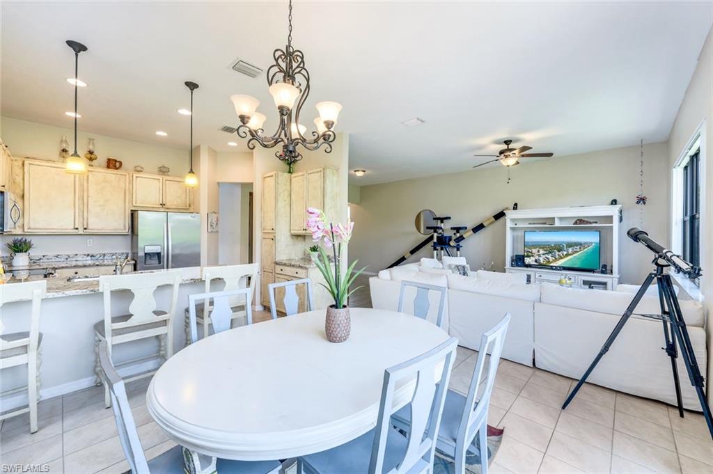 5459 Useppa Drive Ave Maria, FL 34142 - Photo 6 of 21 a very nice looking dining room with a table and chairs
