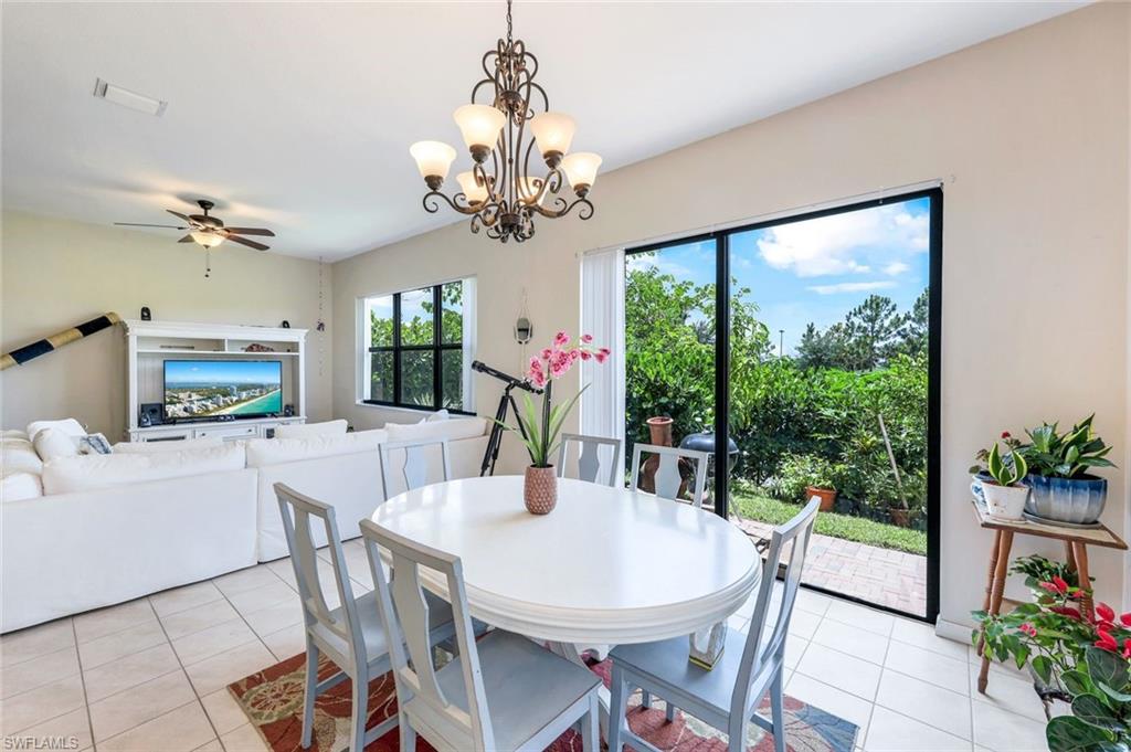 5459 Useppa Drive Ave Maria, FL 34142 - Photo 7 of 21 a view of a dining room with furniture window and outside view