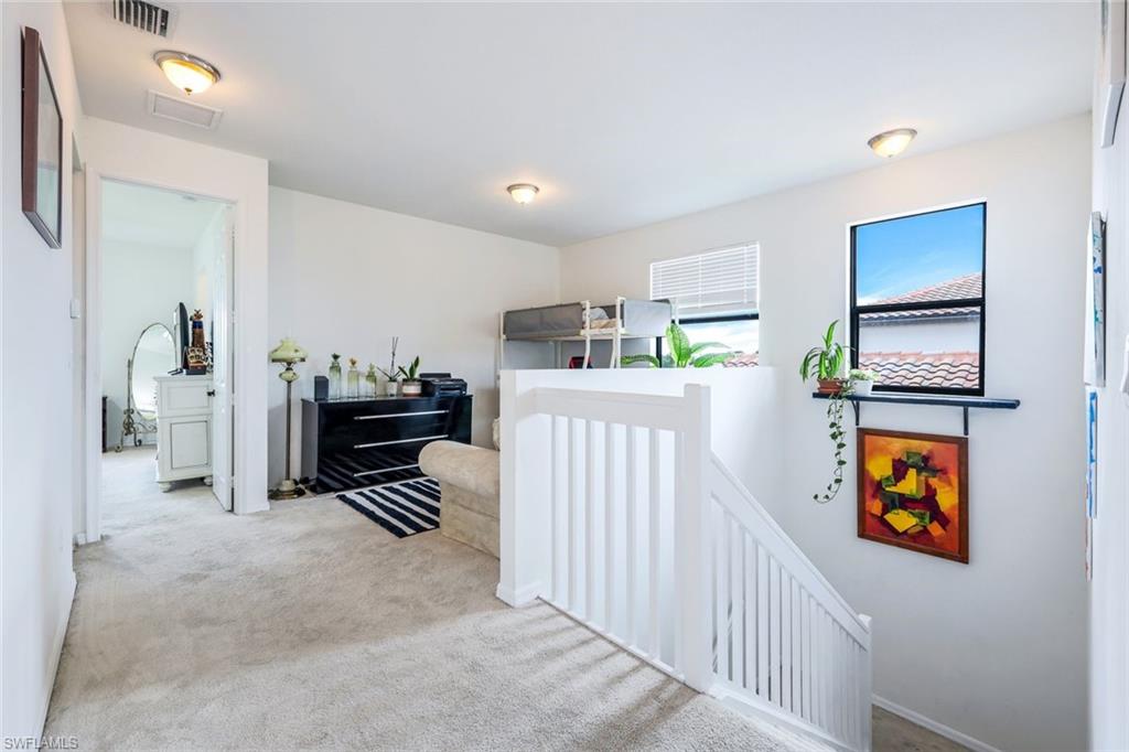 5459 Useppa Drive Ave Maria, FL 34142 - Photo 10 of 21 a room with furniture a ceiling fan and a window