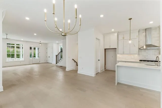a large kitchen with stainless steel appliances
