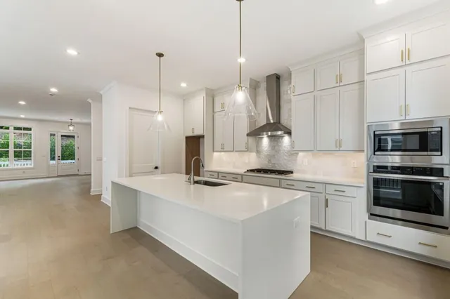 a kitchen with sink and window