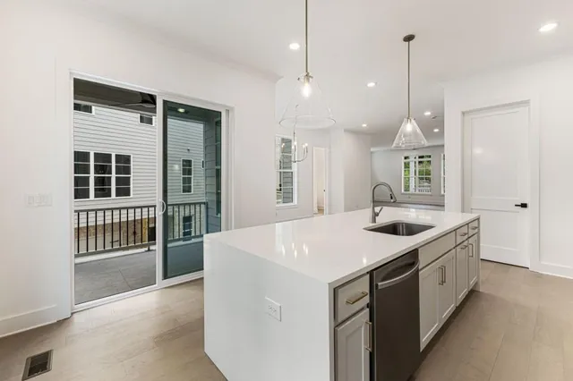 a view of an empty room with stairs