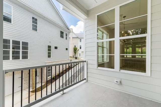 an empty room with a fan & a ceiling fan