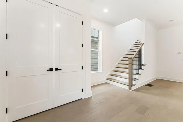 a white bath tub sitting next to a shower