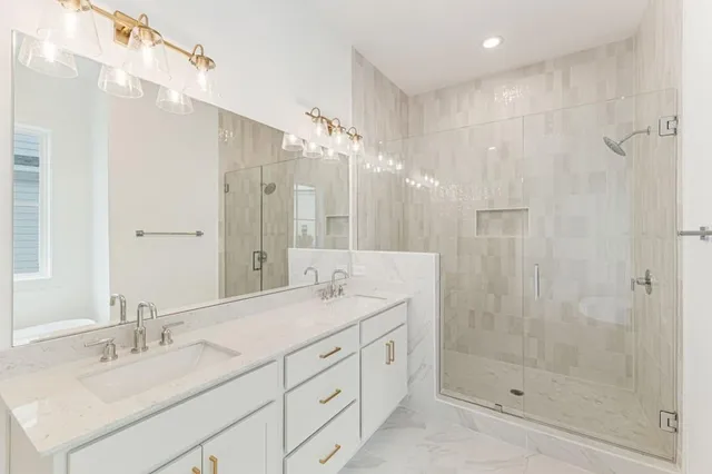 an empty room with windows and ceiling fan