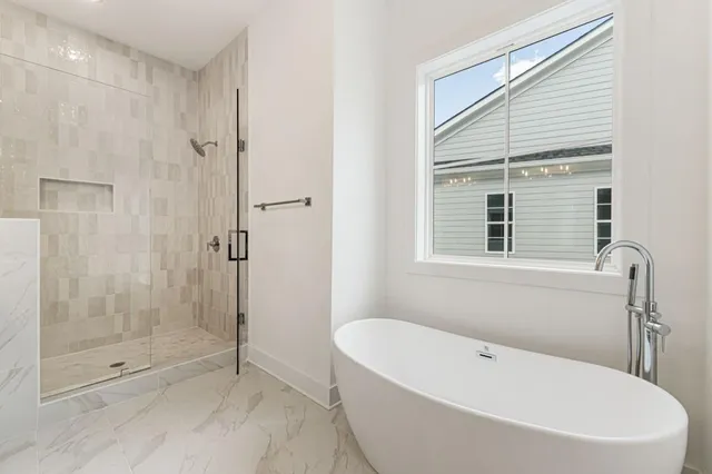 an empty room with a ceiling fan and a window