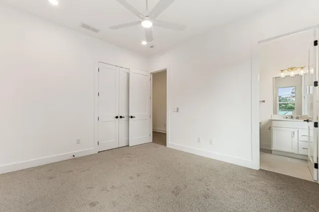 a bathroom with a bathtub shower sink mirror and toilet