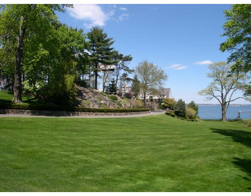 3 Anchorage Lane Marblehead, MA 01945 - Photo 2 of 16 a view of a wooden house with a big yard