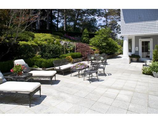 3 Anchorage Lane Marblehead, MA 01945 - Photo 6 of 16 a view of a patio with table and chairs and potted plants