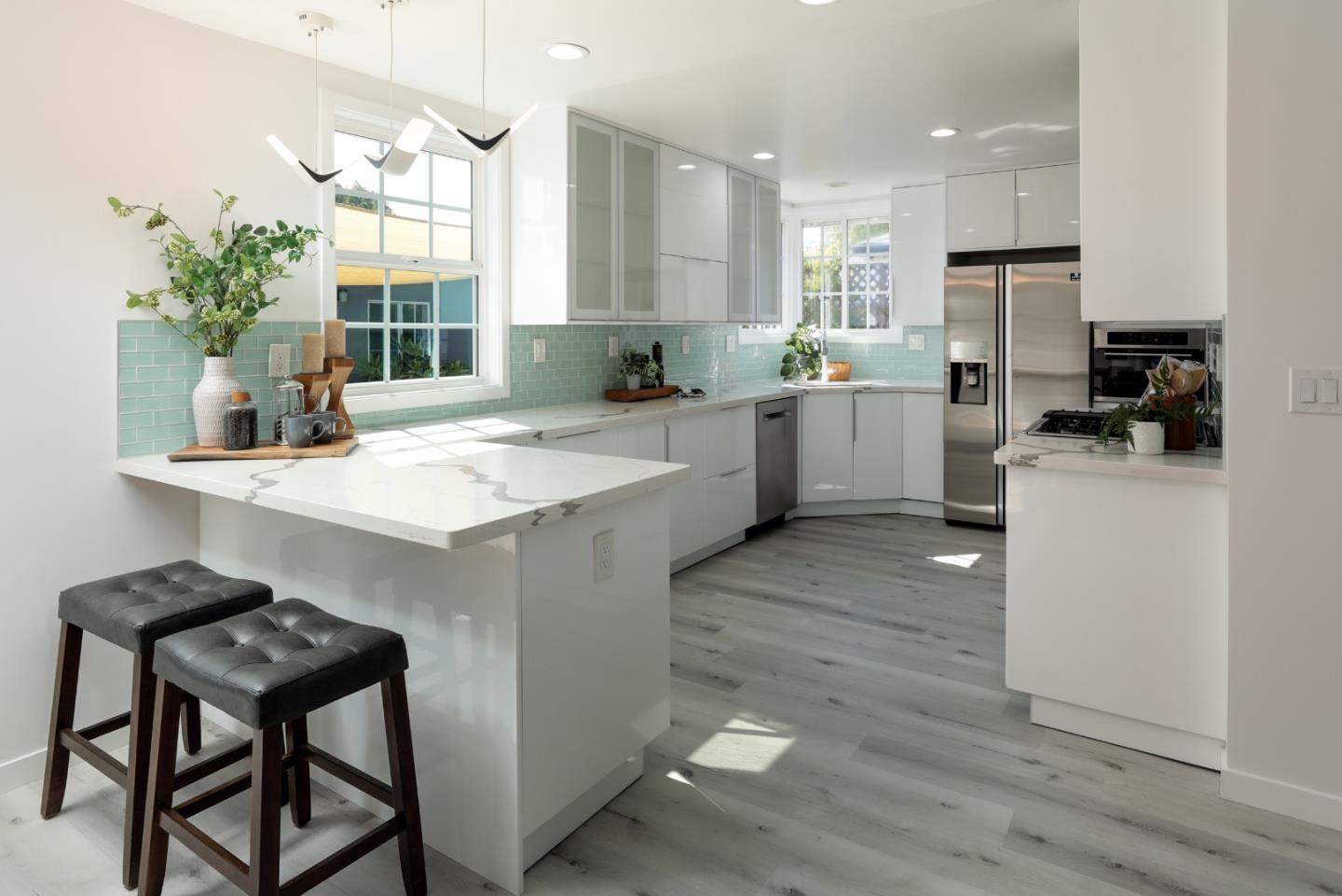 3432 Bay Road Redwood City, CA 94063 - Photo 11 of 33 a kitchen with a sink cabinets and counter space