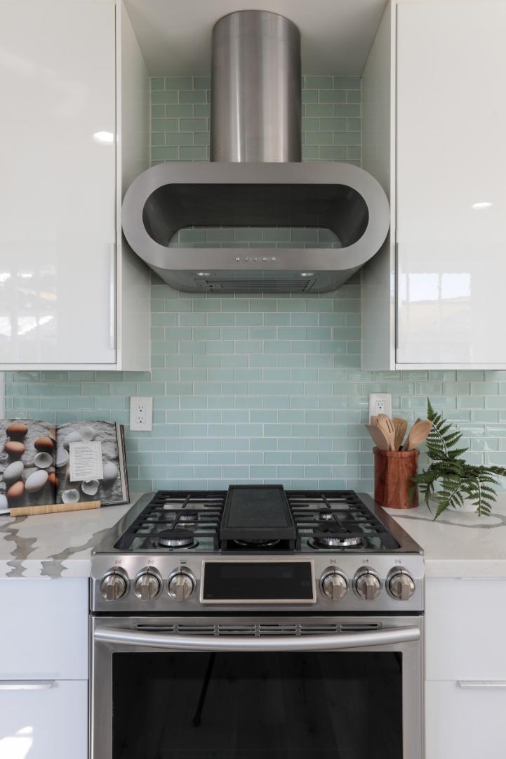 3432 Bay Road Redwood City, CA 94063 - Photo 12 of 33 a stove top oven sitting inside of a kitchen