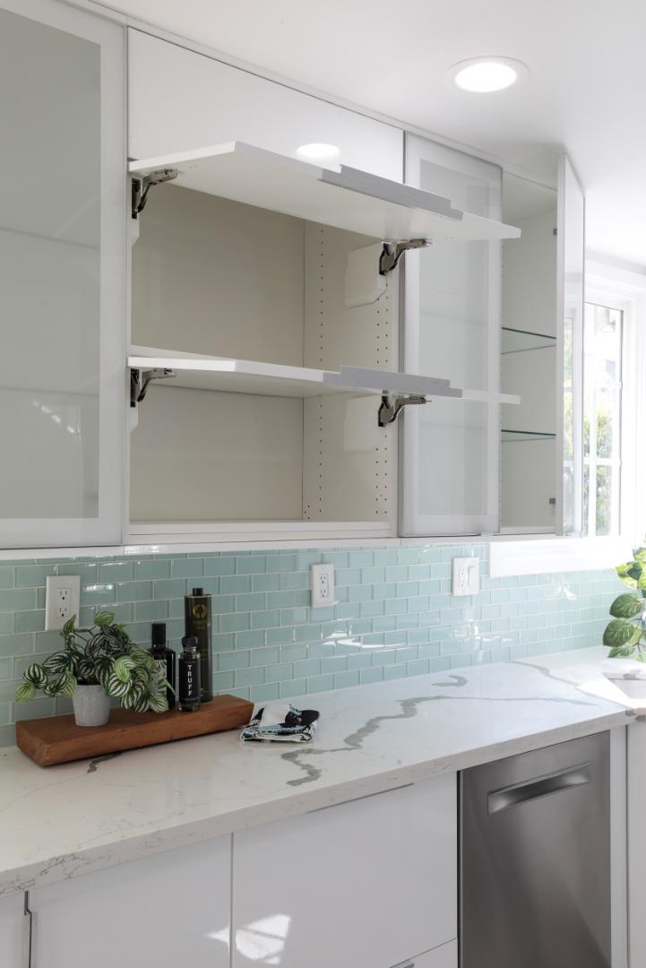 3432 Bay Road Redwood City, CA 94063 - Photo 13 of 33 a kitchen with a sink and potted plant