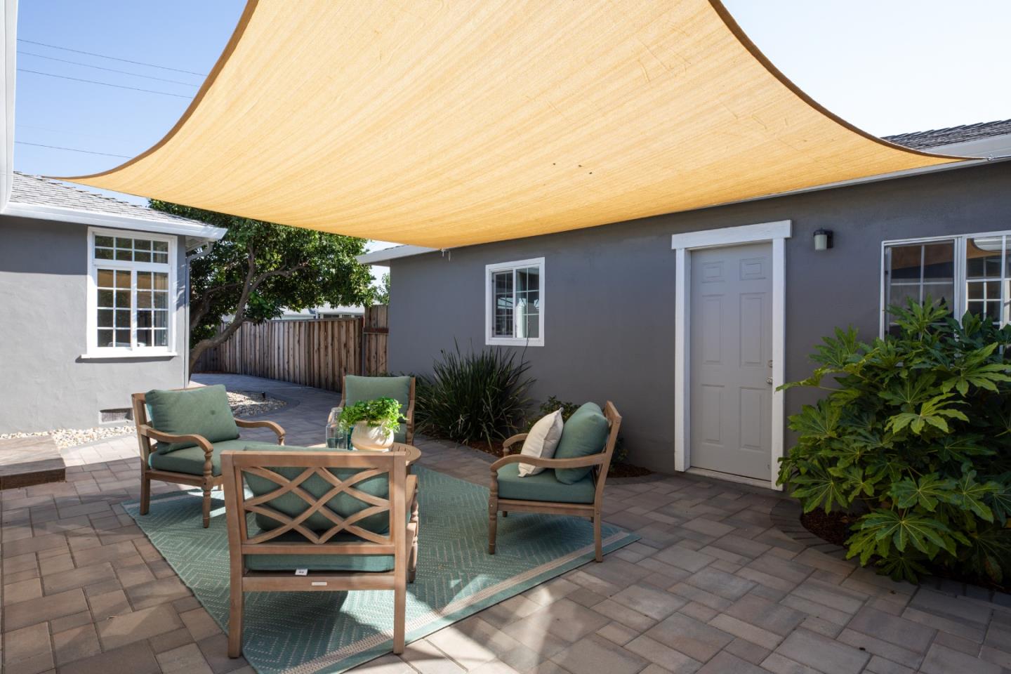 3432 Bay Road Redwood City, CA 94063 - Photo 5 of 33 a view of a backyard with furniture and a fire pit