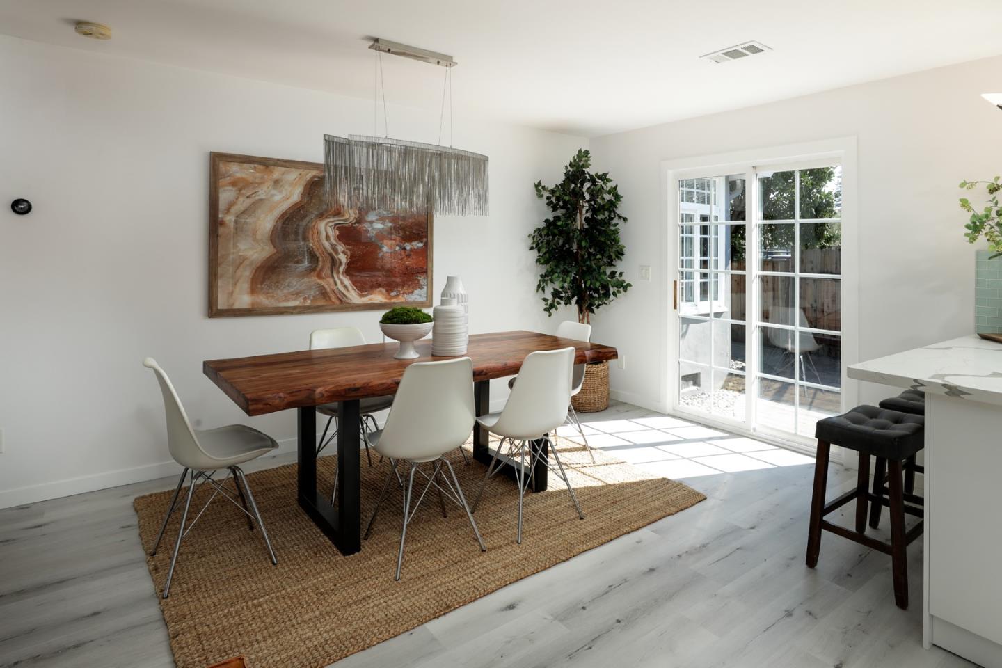 3432 Bay Road Redwood City, CA 94063 - Photo 10 of 33 a view of a dining room with furniture and wooden floor