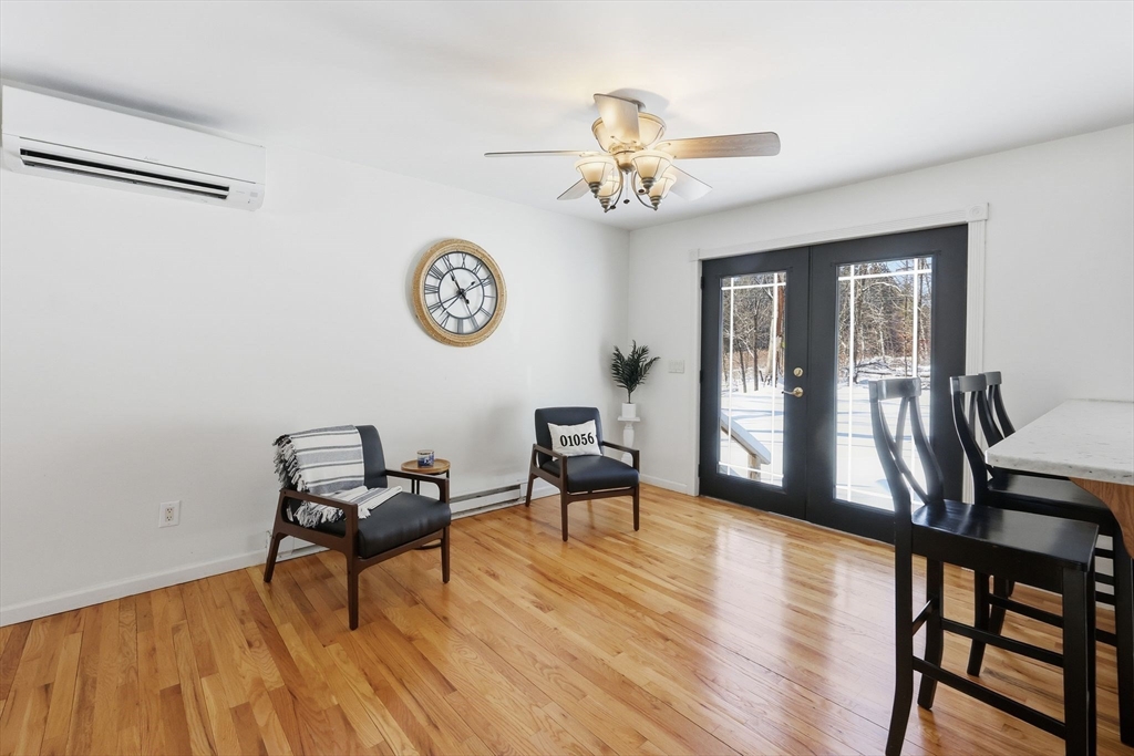 429 Moore Street Ludlow, MA 01056 - Photo 11 of 41 a view of a room with furniture wooden floor and a chandelier