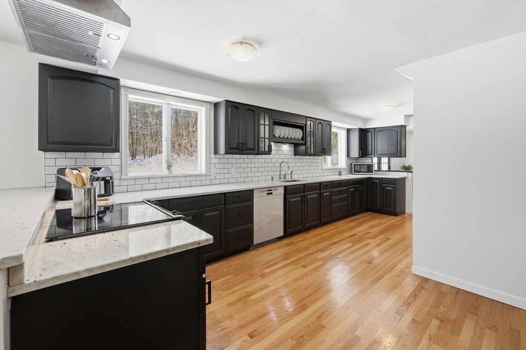 429 Moore Street Ludlow, MA 01056 - Photo 14 of 41 a kitchen with a sink stove top oven and refrigerator