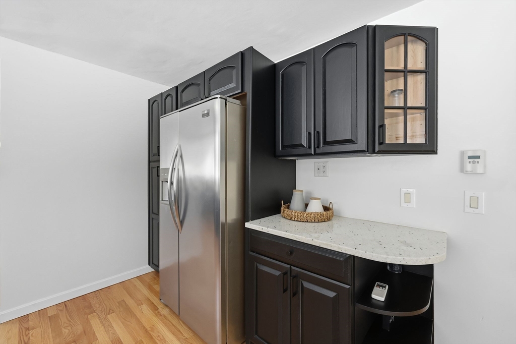429 Moore Street Ludlow, MA 01056 - Photo 15 of 41 a kitchen with a refrigerator and a sink