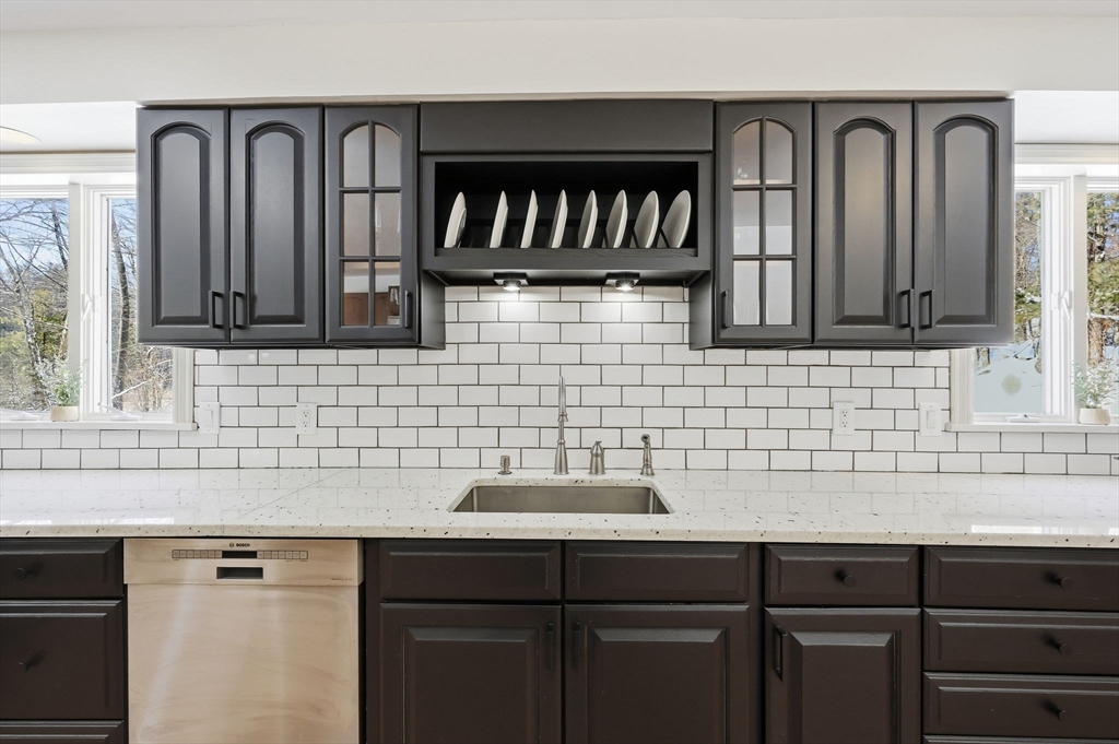 429 Moore Street Ludlow, MA 01056 - Photo 17 of 41 a kitchen with a sink cabinets and a window