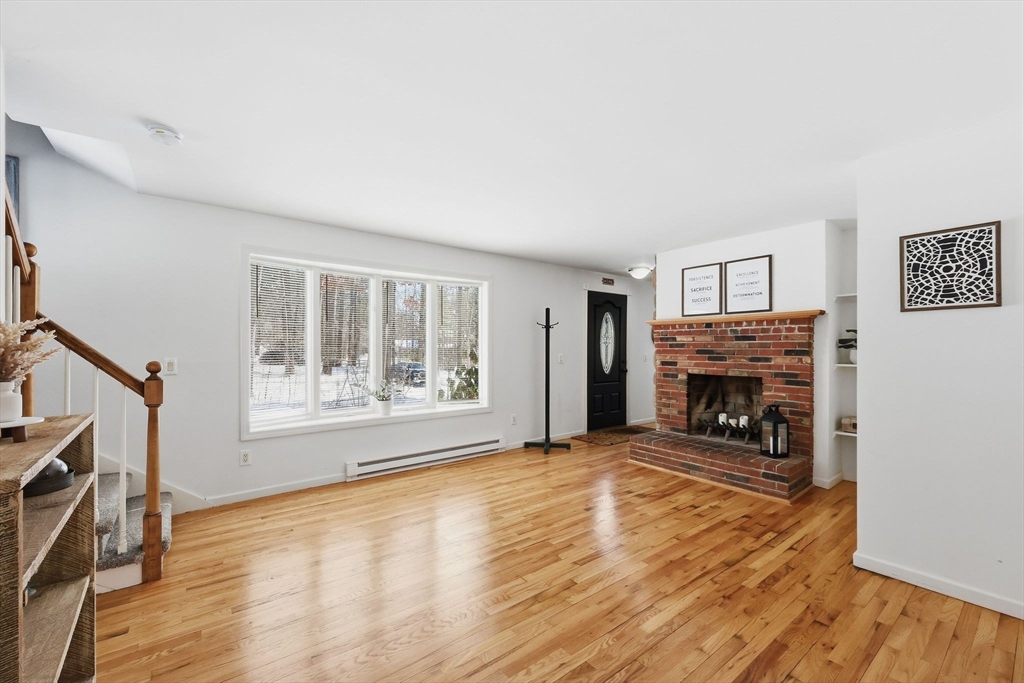 429 Moore Street Ludlow, MA 01056 - Photo 25 of 41 a view of an empty room with a fireplace and a window