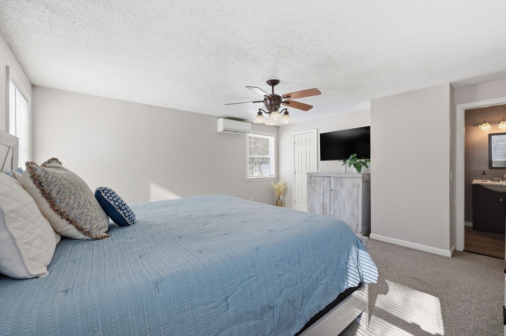 429 Moore Street Ludlow, MA 01056 - Photo 30 of 41 a bedroom with a bed and a flat screen tv