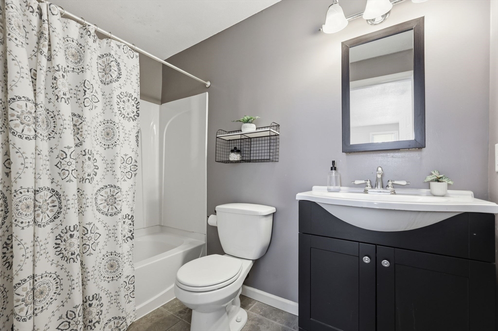 429 Moore Street Ludlow, MA 01056 - Photo 31 of 41 a bathroom with a sink toilet and a mirror