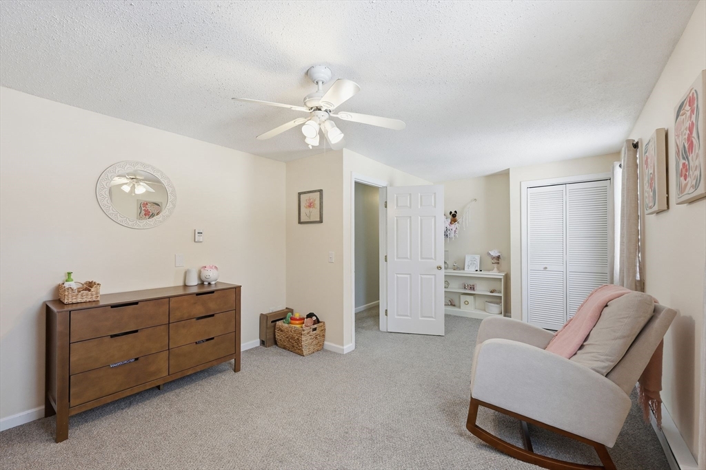 429 Moore Street Ludlow, MA 01056 - Photo 33 of 41 a living room with furniture and a chandelier